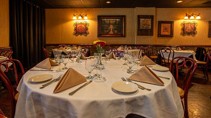 Dining room with round set table for six